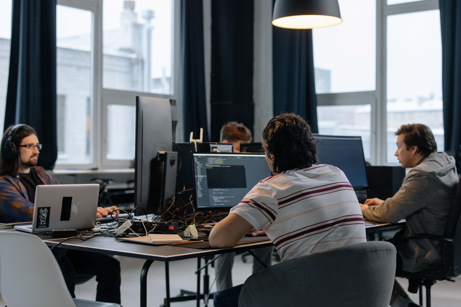 Software developers collaborating in a modern technology office